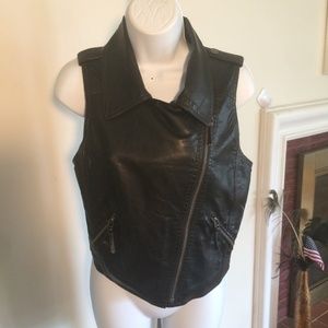 SMALL  LEATHER LIKE VEST .BLACK CYCLE READY FOR .
